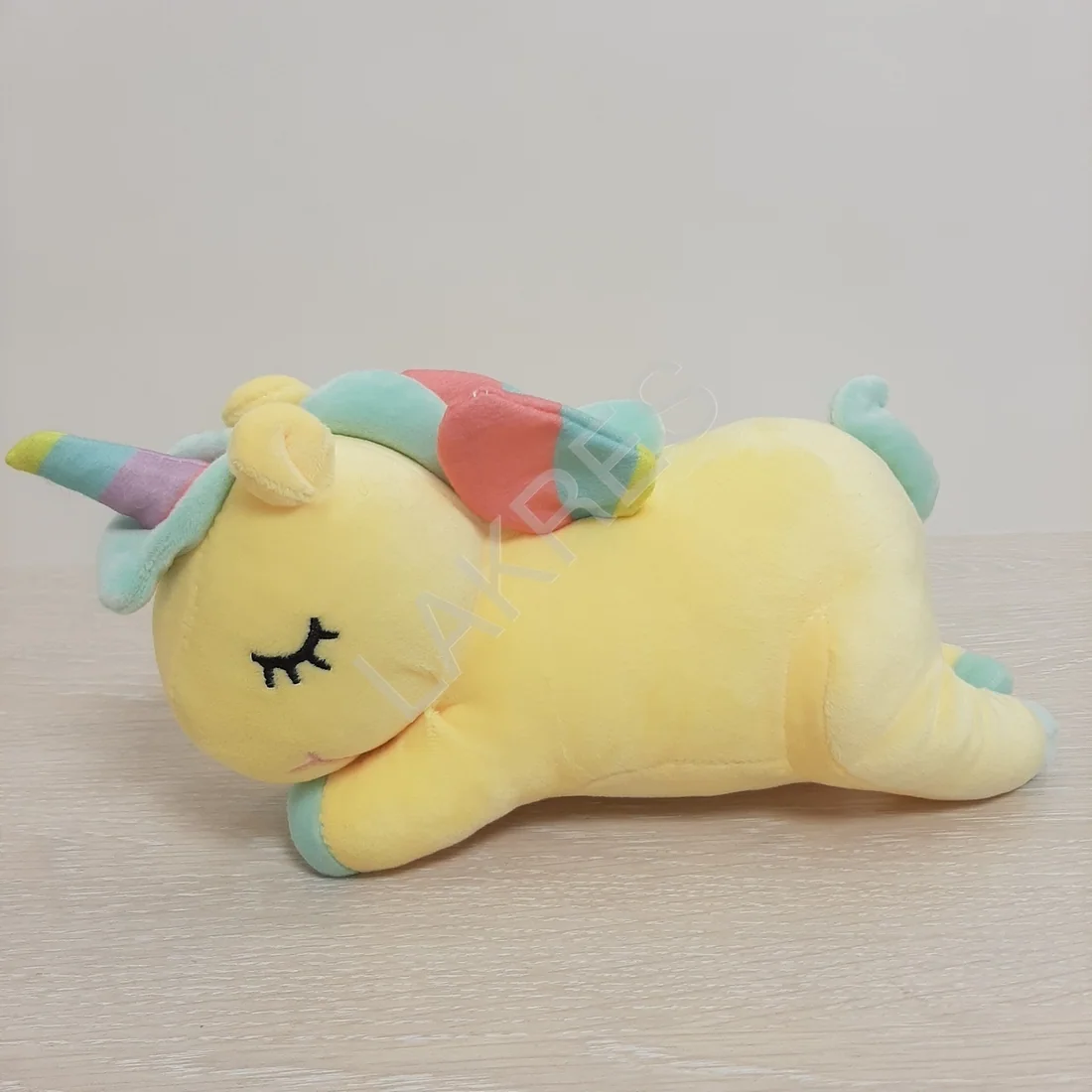 Игрушка Единорог желтый